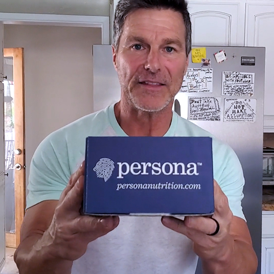 Man holding Persona vitamin box